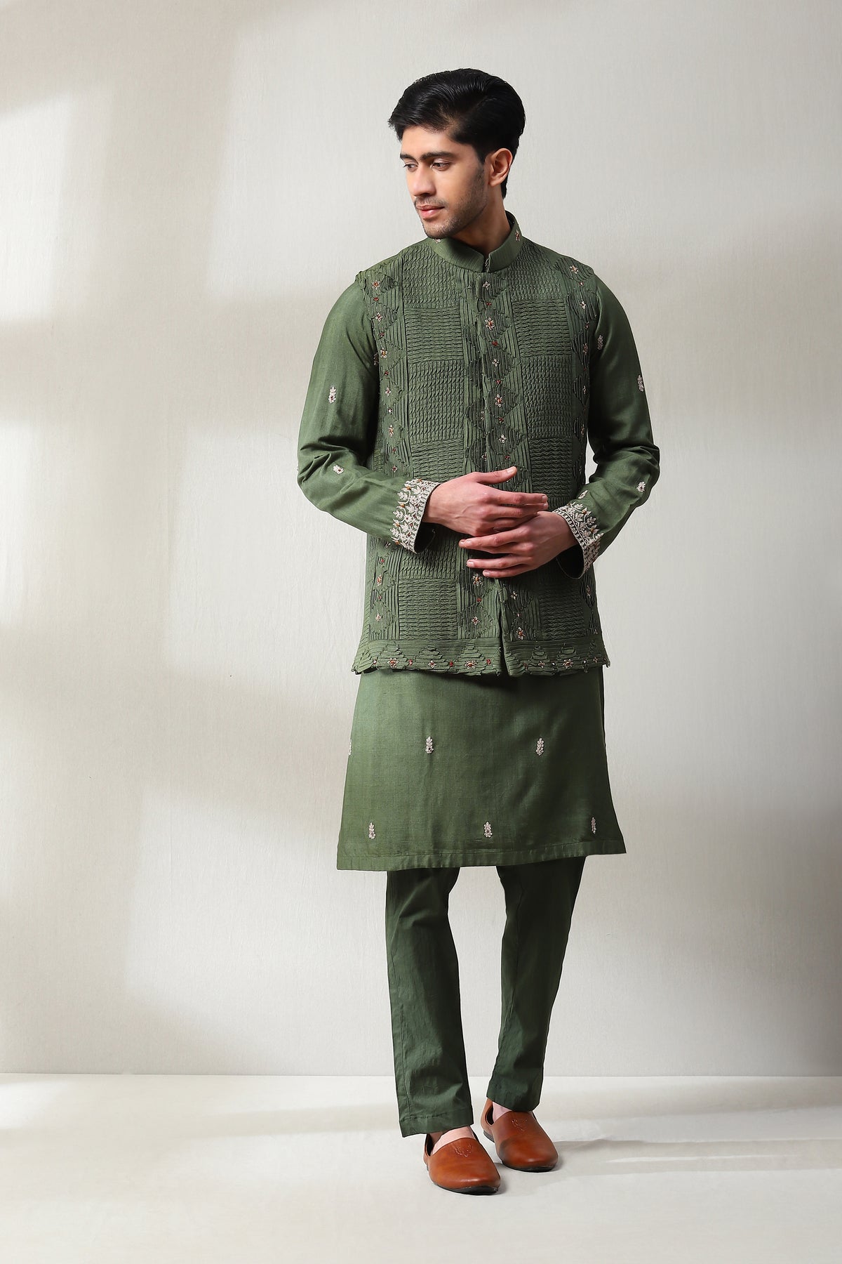 This patterned pleted handspun mehndi green  jacket with same color pants