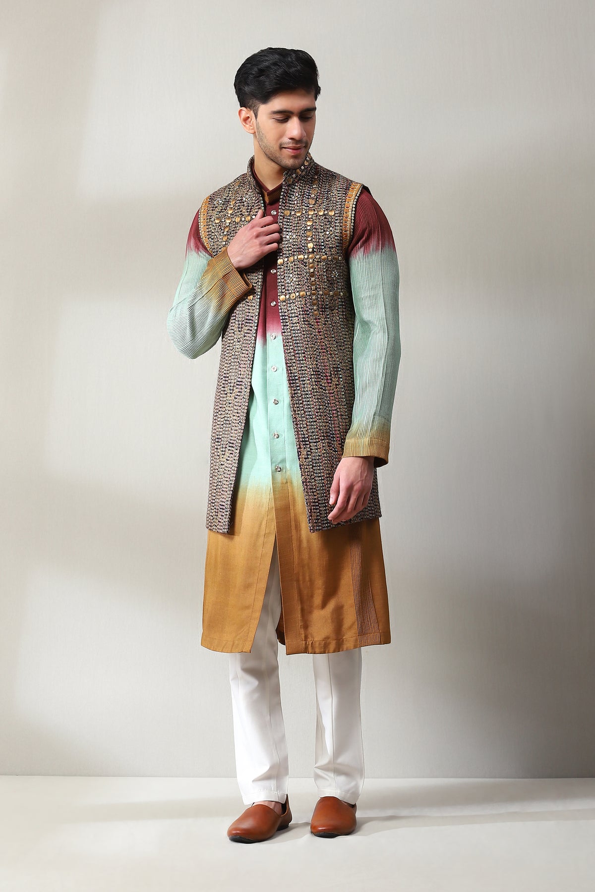 This handloom multicoloured open long sleeveless jacket with the slim pants