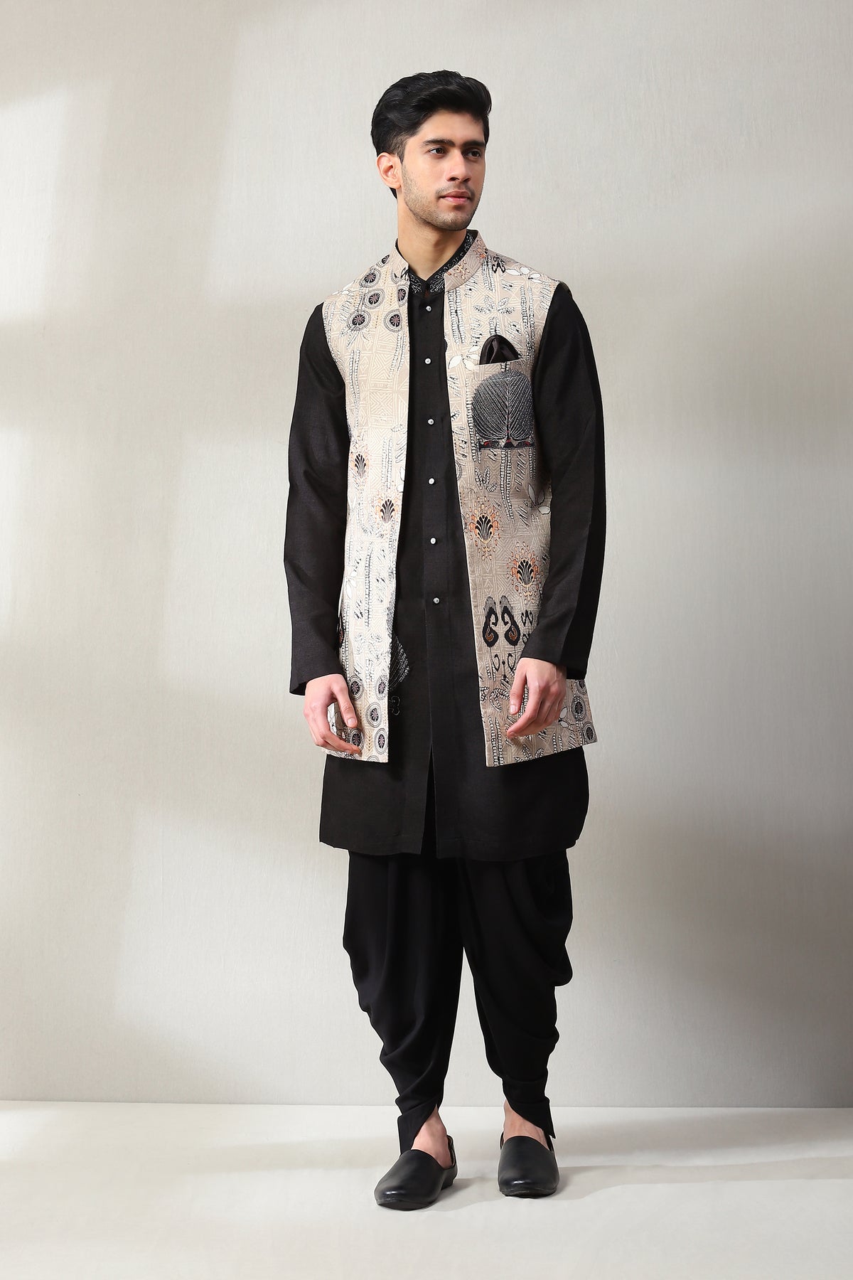 This handmade printed long jacket  has been embroided with aari tilla work on the jacket