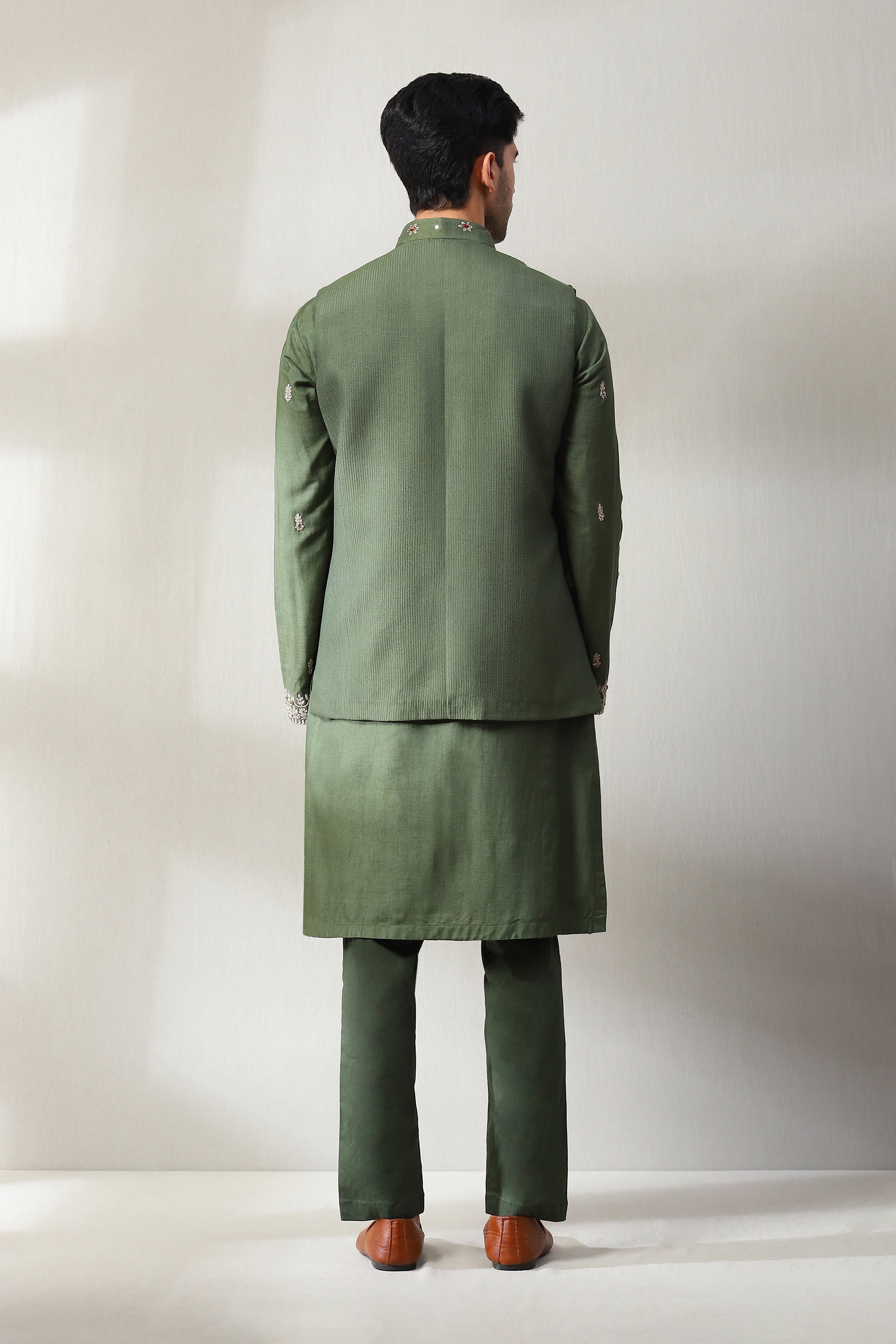 This patterned pleted handspun mehndi green jacket with same color pan shop soniyag
