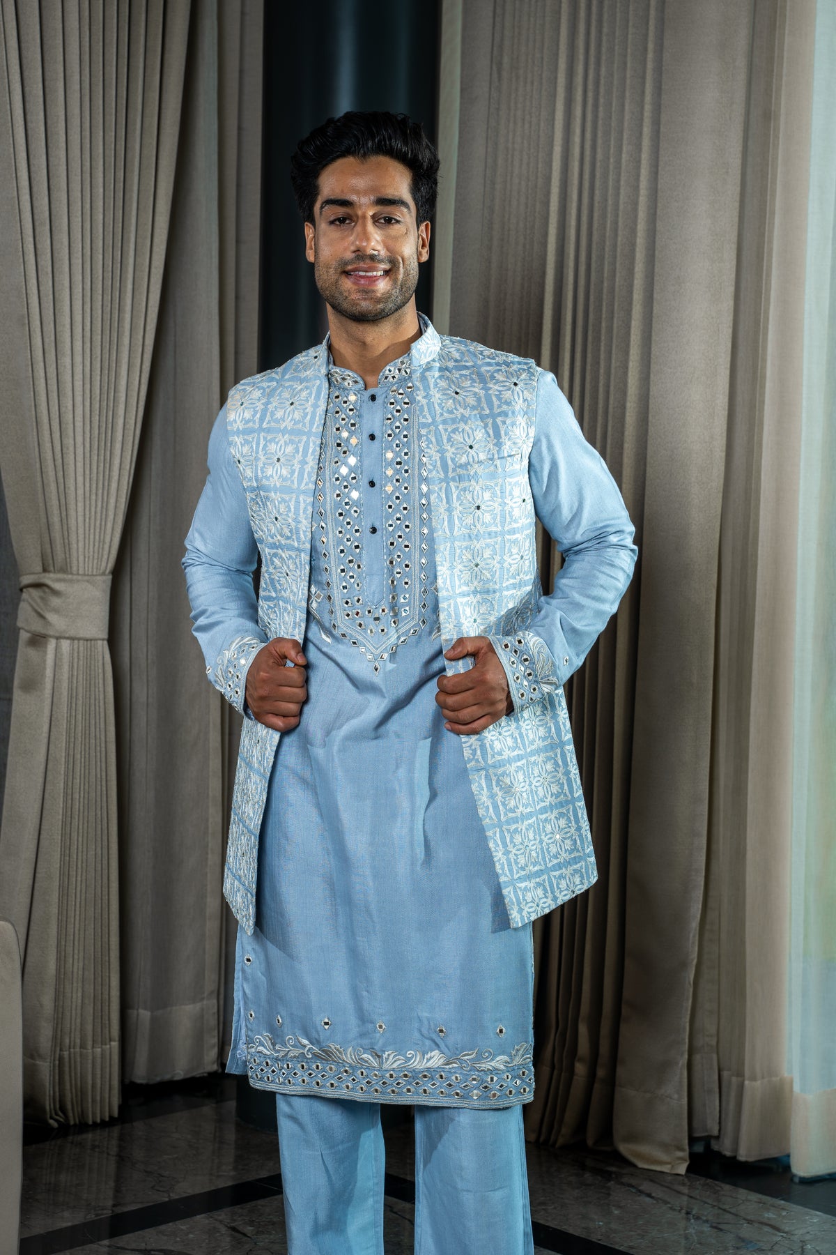 This ice blue colored sleeveless jacket