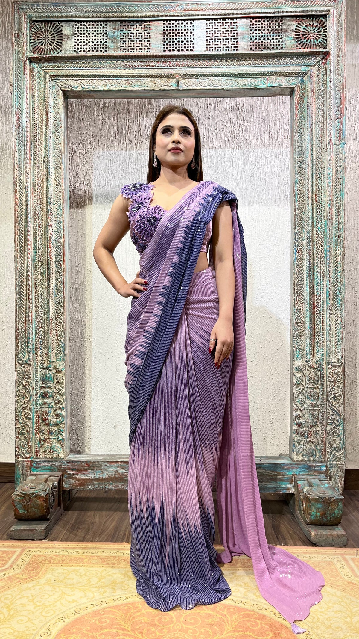 Sequence drape saree  with flower patches at the blouse
