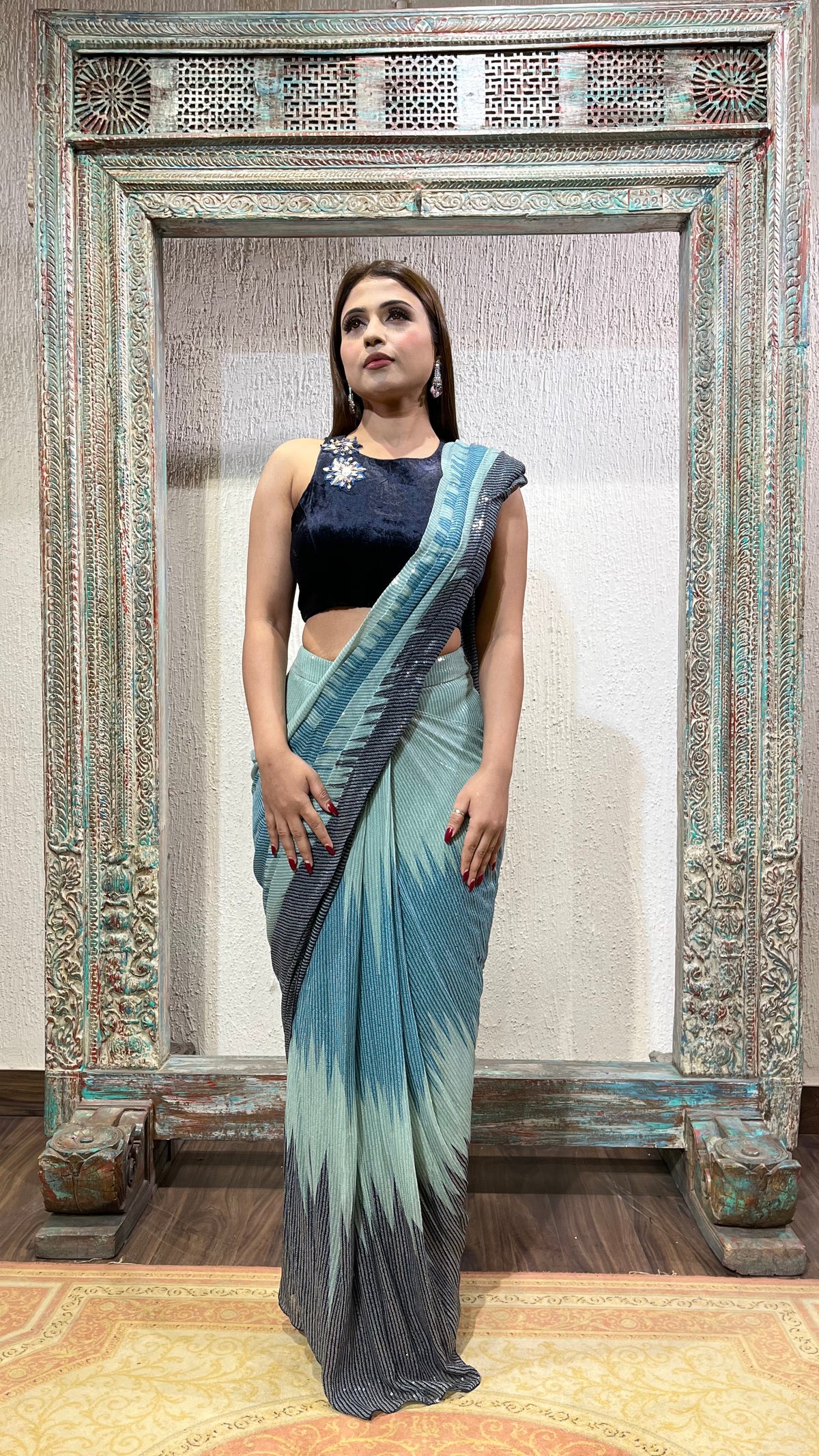 Sequence saree with velvet blouse.