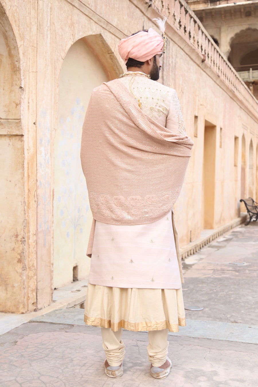 Sherwani Matched With Nude Pink Coloured Stole And Other Accessories