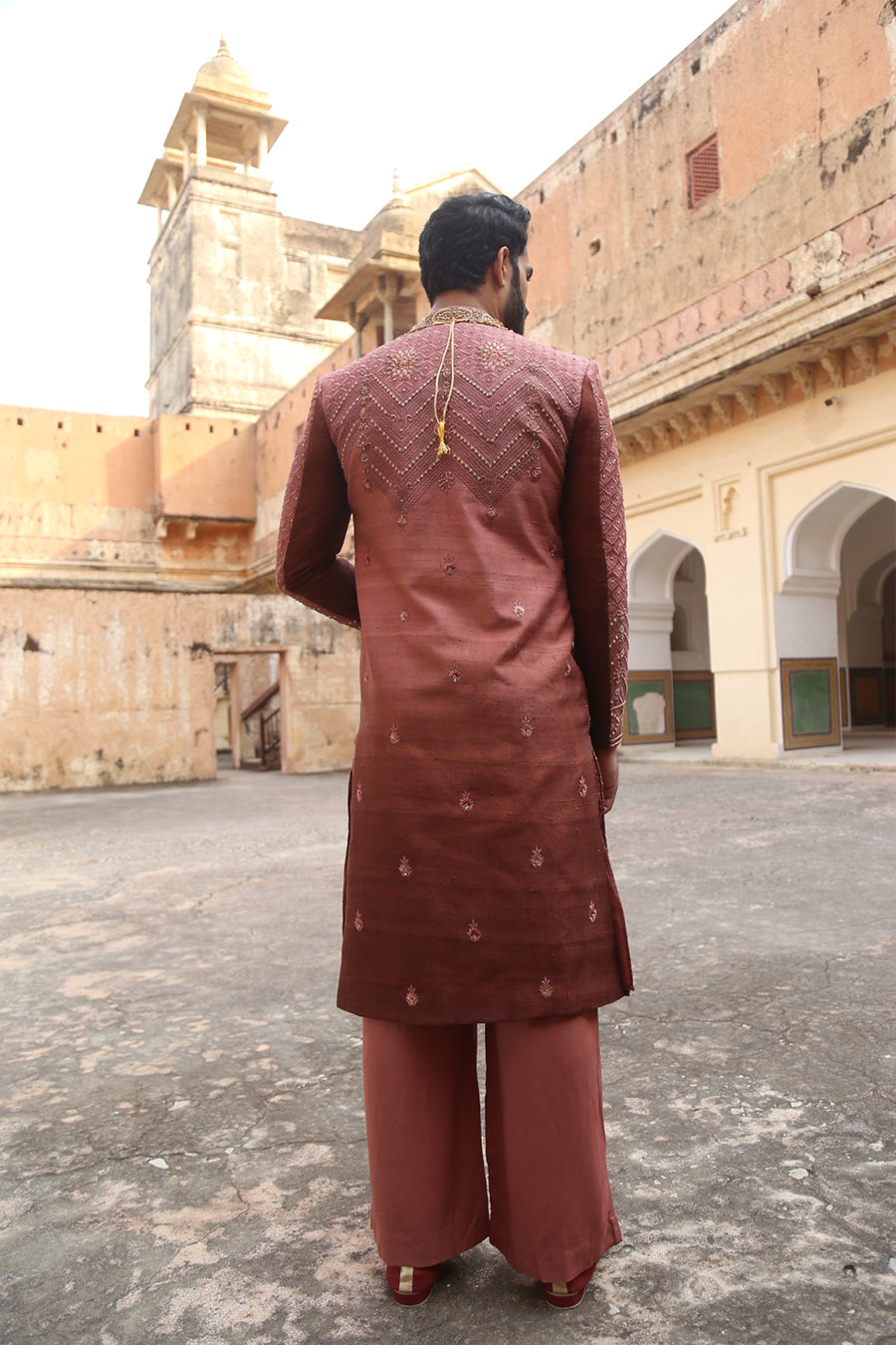 Sherwani Matched With A Carrot Coloured Velvet Stole And Accessories