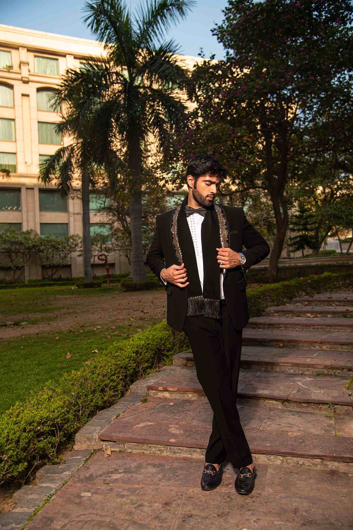 Black Embellished Tuxedo With Metal Work On The Lapel And A Matching Scarf