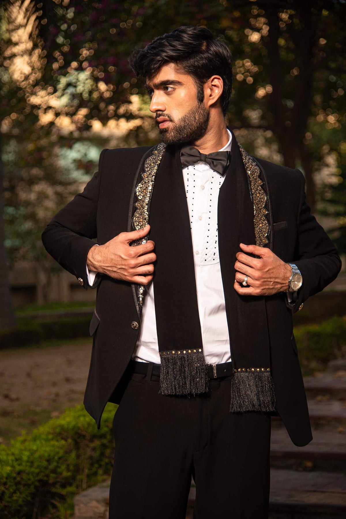 Black Embellished Tuxedo With Metal Work On The Lapel And A Matching Scarf