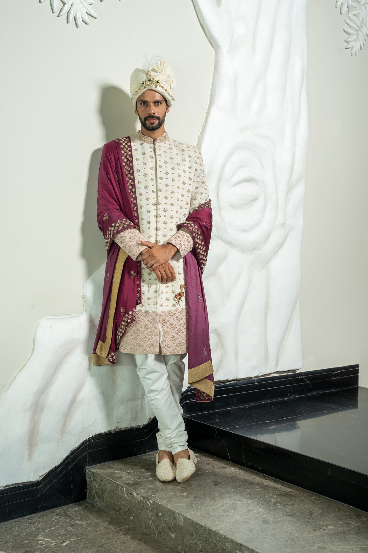 This ivory colored jacquard sherwani